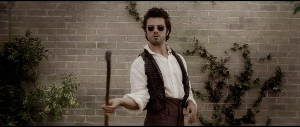 Still of Henry Sturges (Dominic Cooper) swinging an axe in Abraham Lincoln: Vampire Hunter