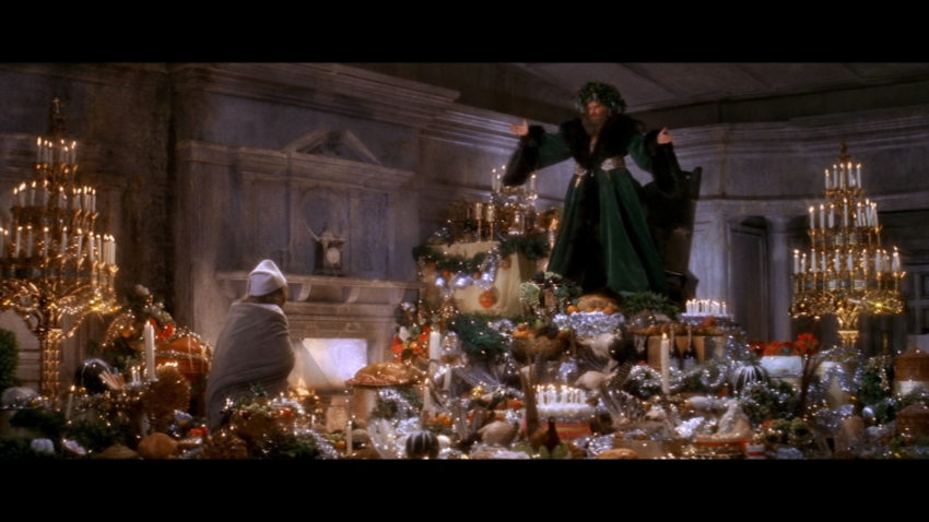 The Ghost of Christmas Present and Scrooge in Scrooge (1970)